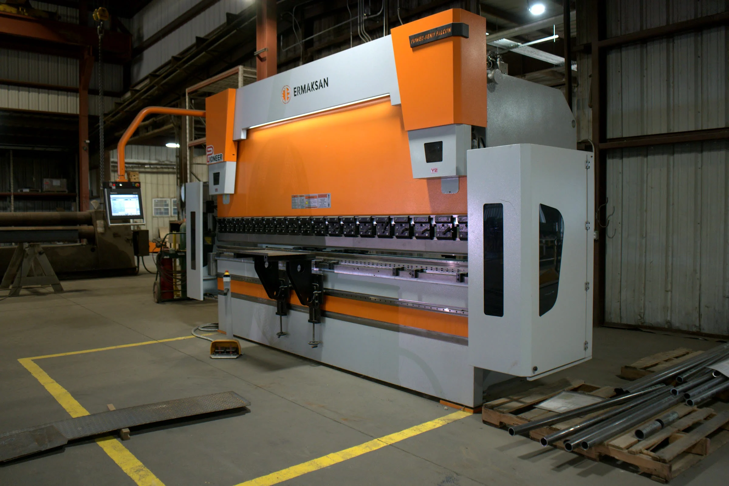 Press brake forming a plate at the Hawk Fabrication shop
