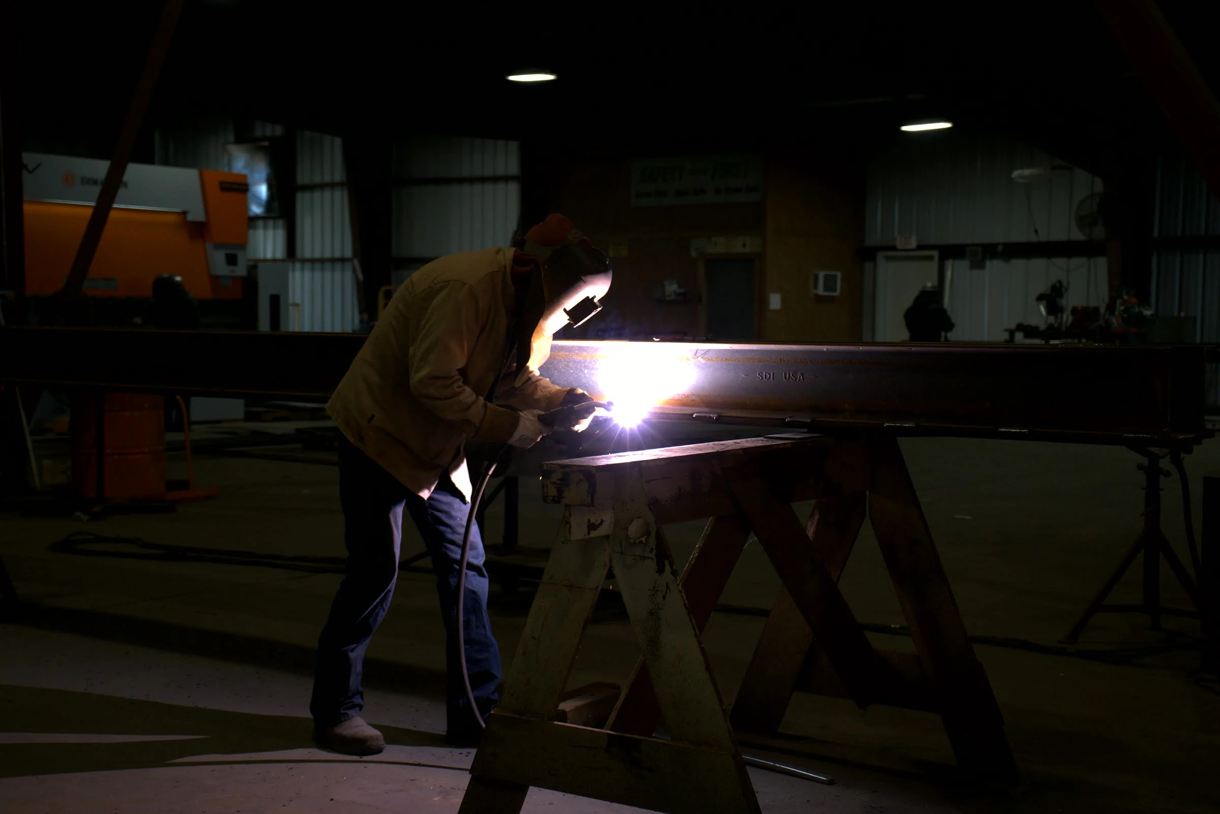 Detail shot, a welder on pipe
